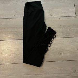 Black leggings with crisscross and mesh on the shins